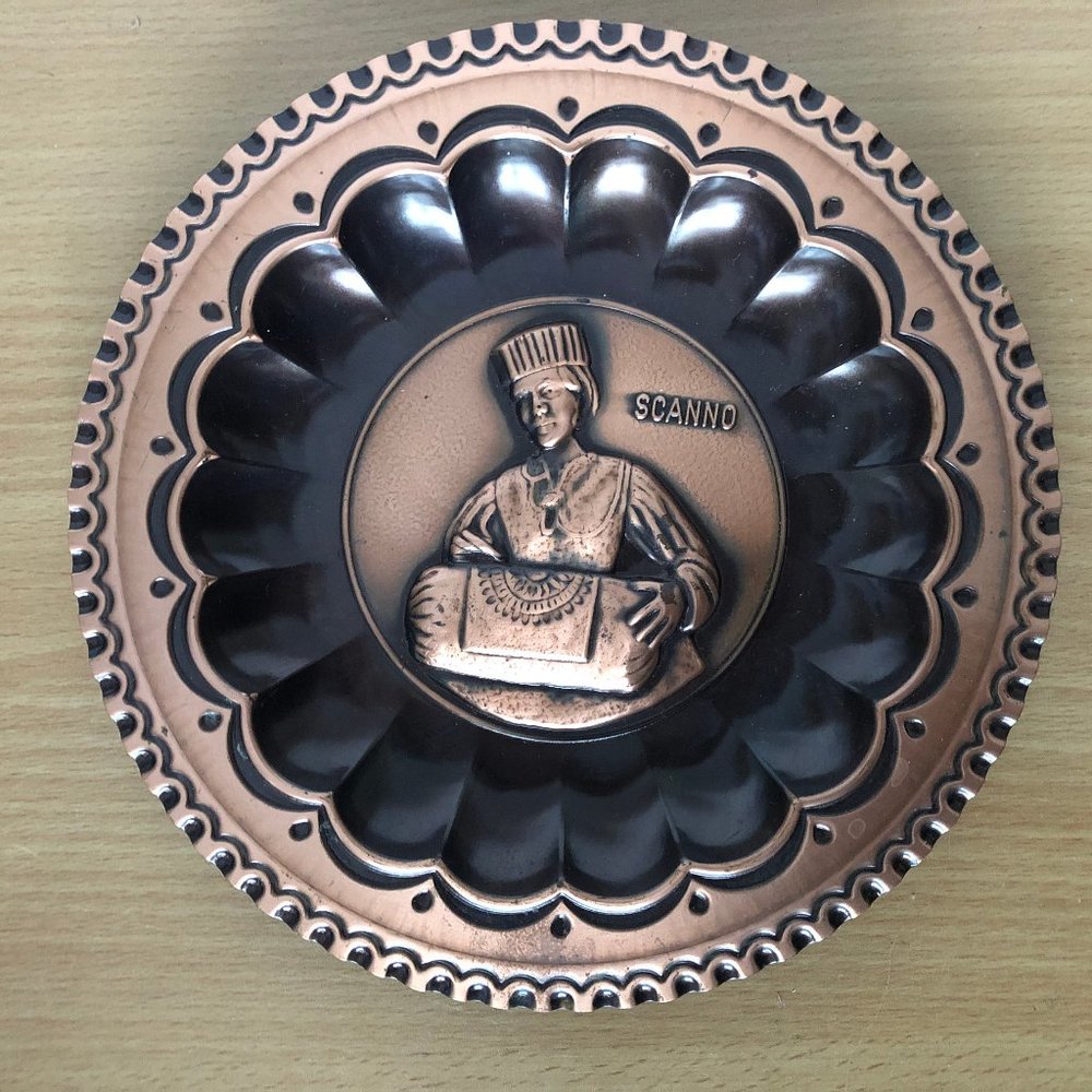 Vintage Italian metal copper plate man carrying a box Scanno